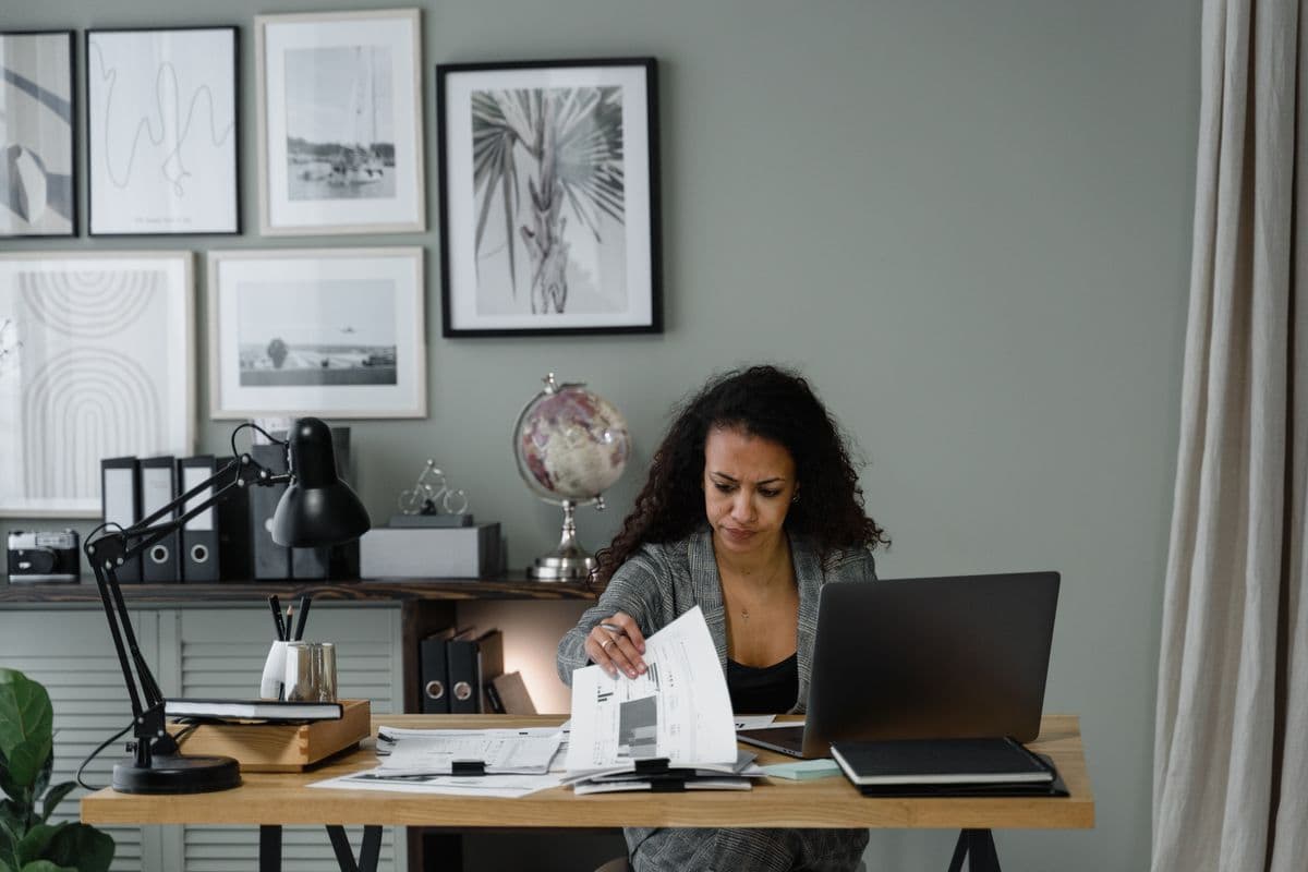 An accountant working through a client's books at a desk