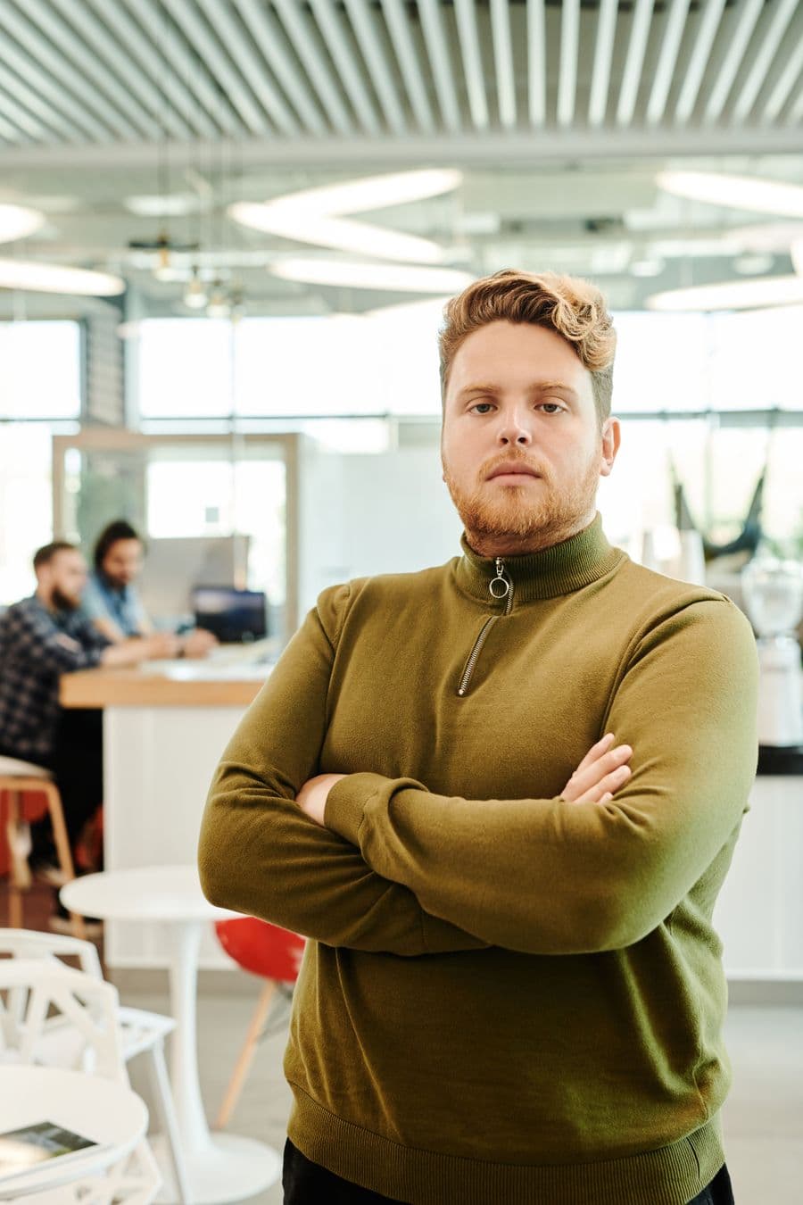A business owner standing in the workspace they run
