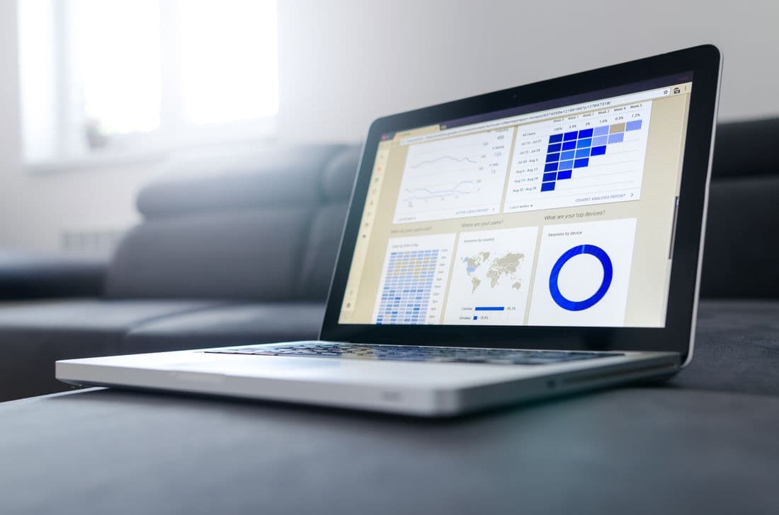 A laptop showing an analytics dashboard on a desk
