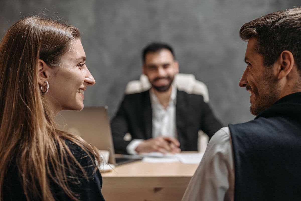 A client and their advisers talking around a table in the office